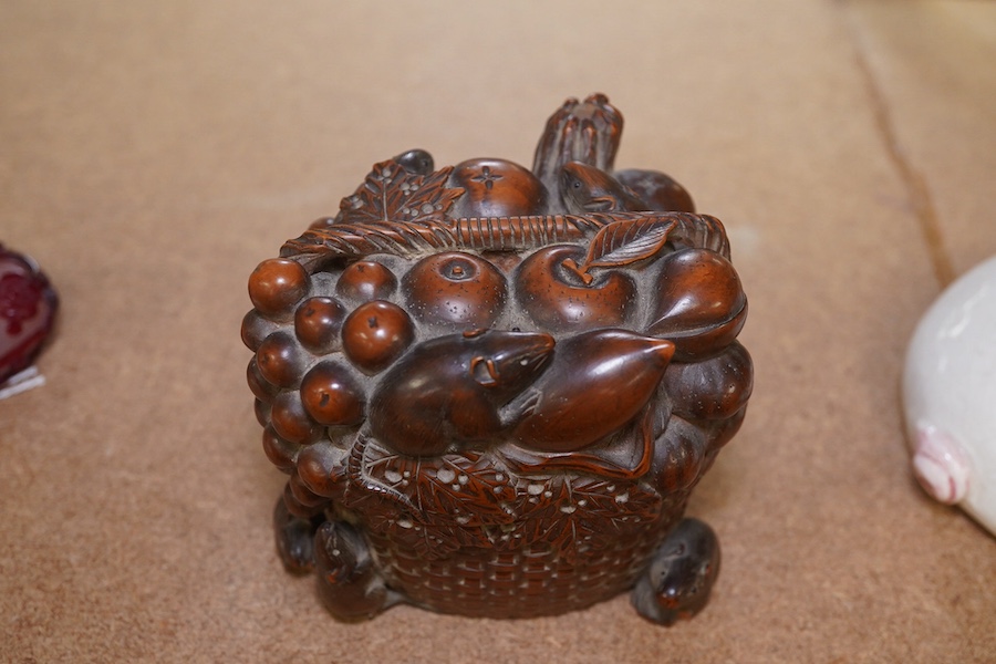 A Japanese boxwood koro and cover, Meiji period, modelled as a basket of fruit with mice, signed to the base, 9cm wide. Condition - fair to good, some chipping